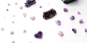 purple and white stones on white surface